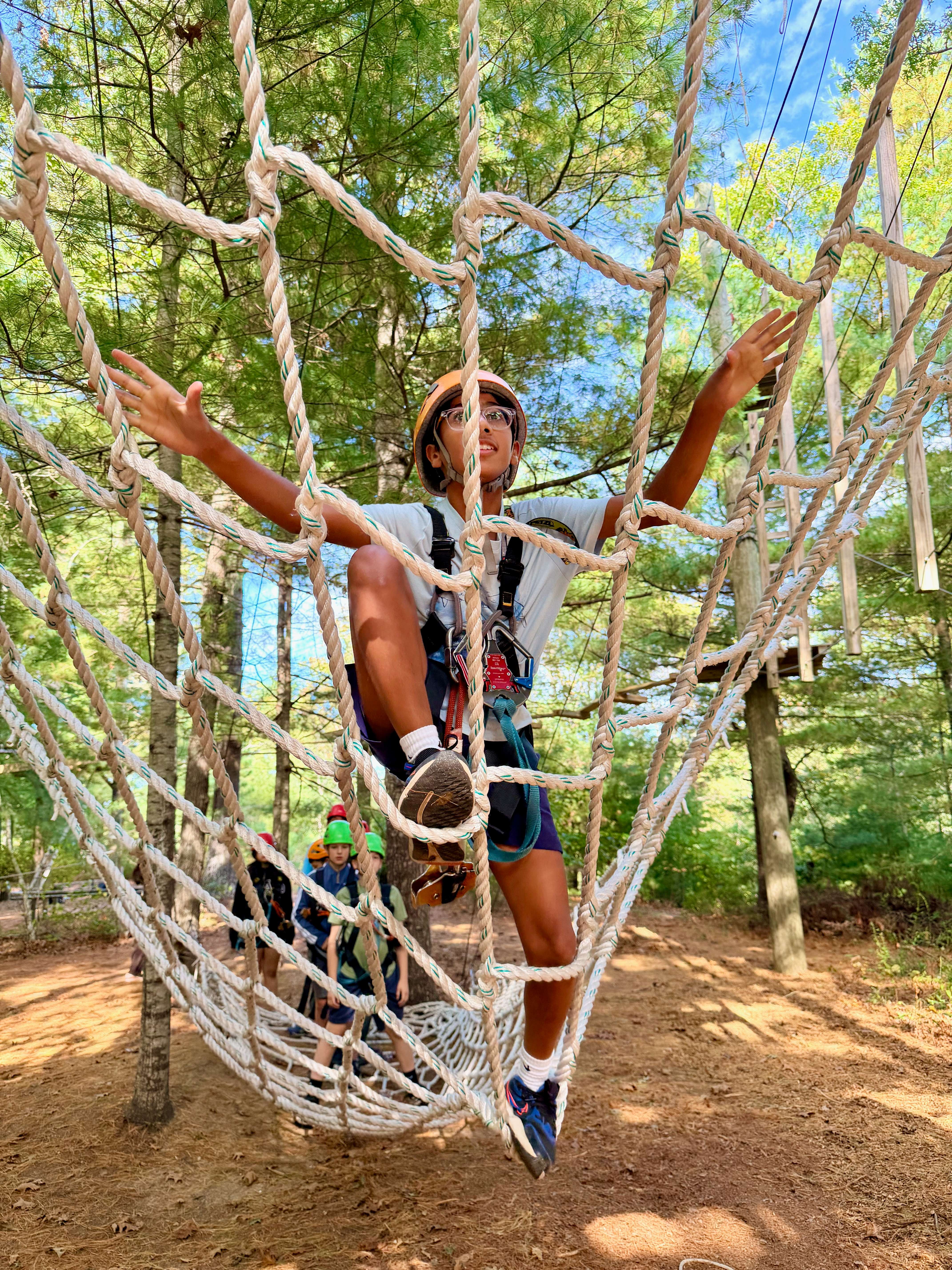 A WSA student navigating a high ropes course at the school retreat