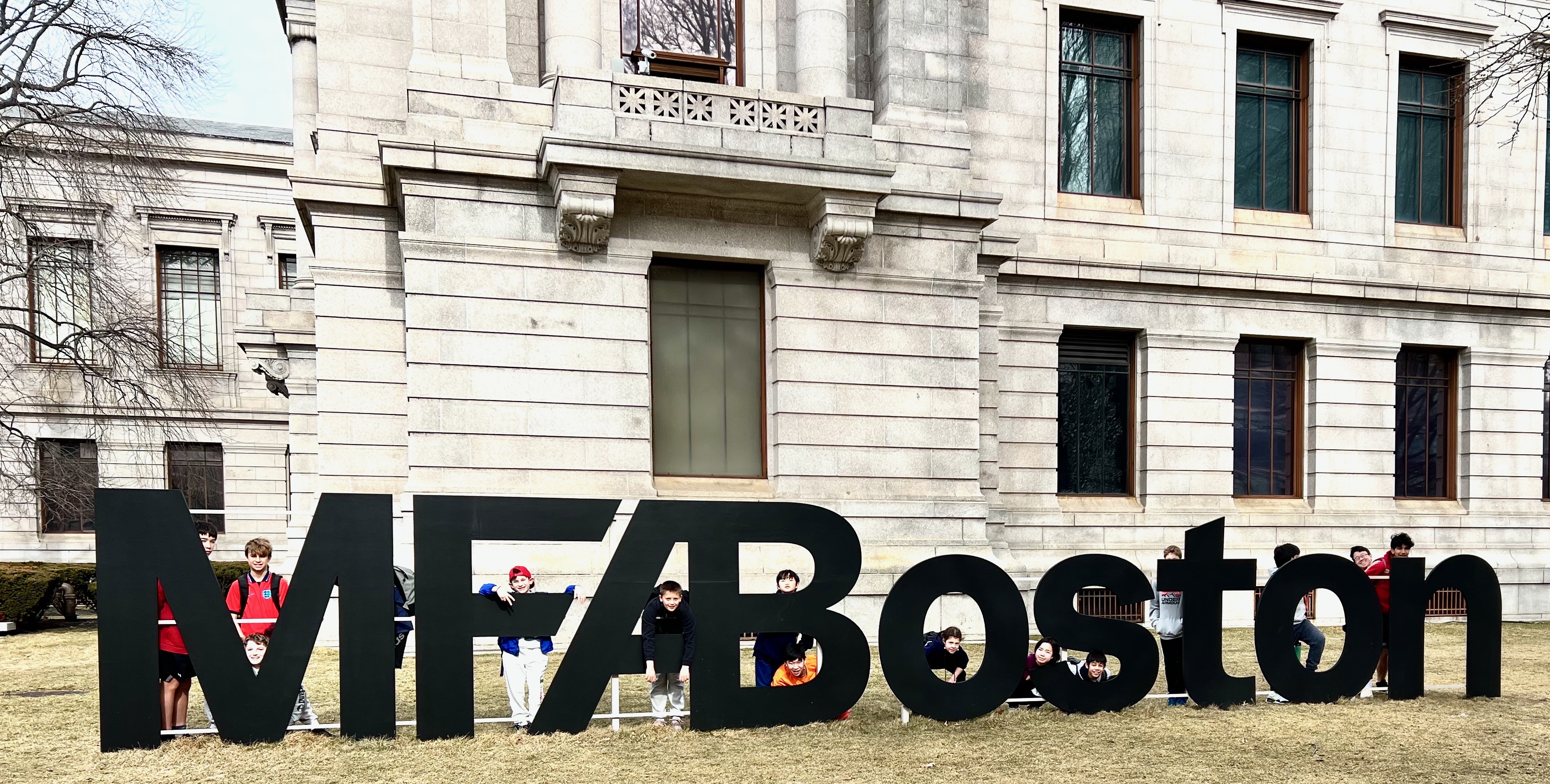 WSA students posing with the giant MFA Boston letters outside the Museum of Fine Arts